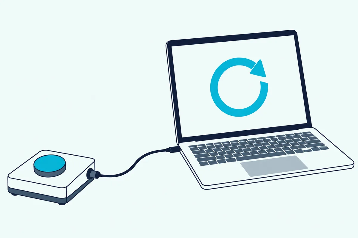 A single-button footswitch on the floor cabled to a laptop that shows a circular loop arrow