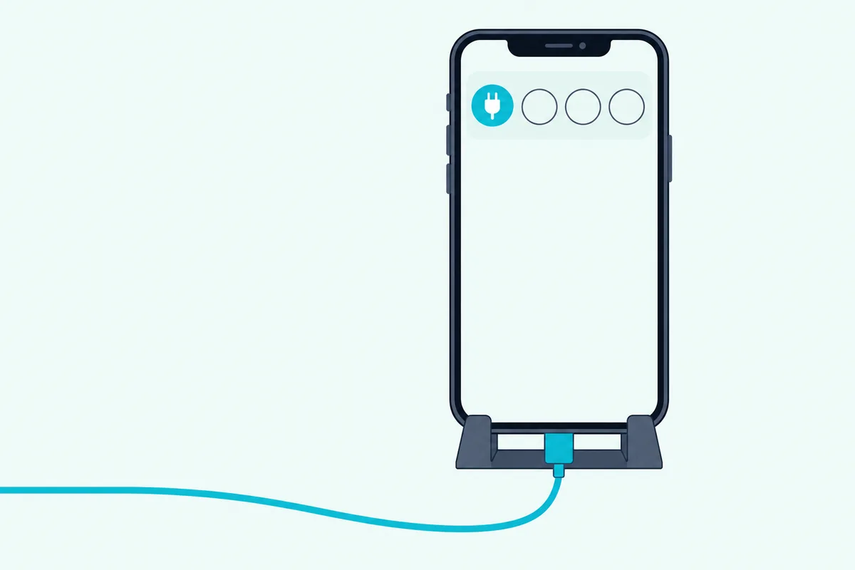 Phone on a stand with a USB cable plugged in and one teal plug tile highlighted on its screen