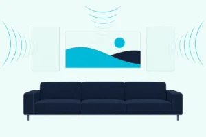 A living room wall with fabric panels in the wall color and a printed art panel above a sofa