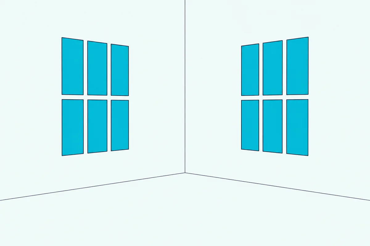 A room corner with fabric panels hung in a grid on each of two adjacent walls
