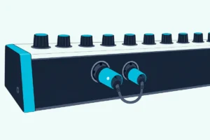 A small two-plug MIDI adapter in the round sockets on the back panel of a synthesizer, with one tiny light on the larger plug