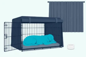 A dog resting in a wire crate with a dark cover and rolled-up front panel, a small white noise machine beside it