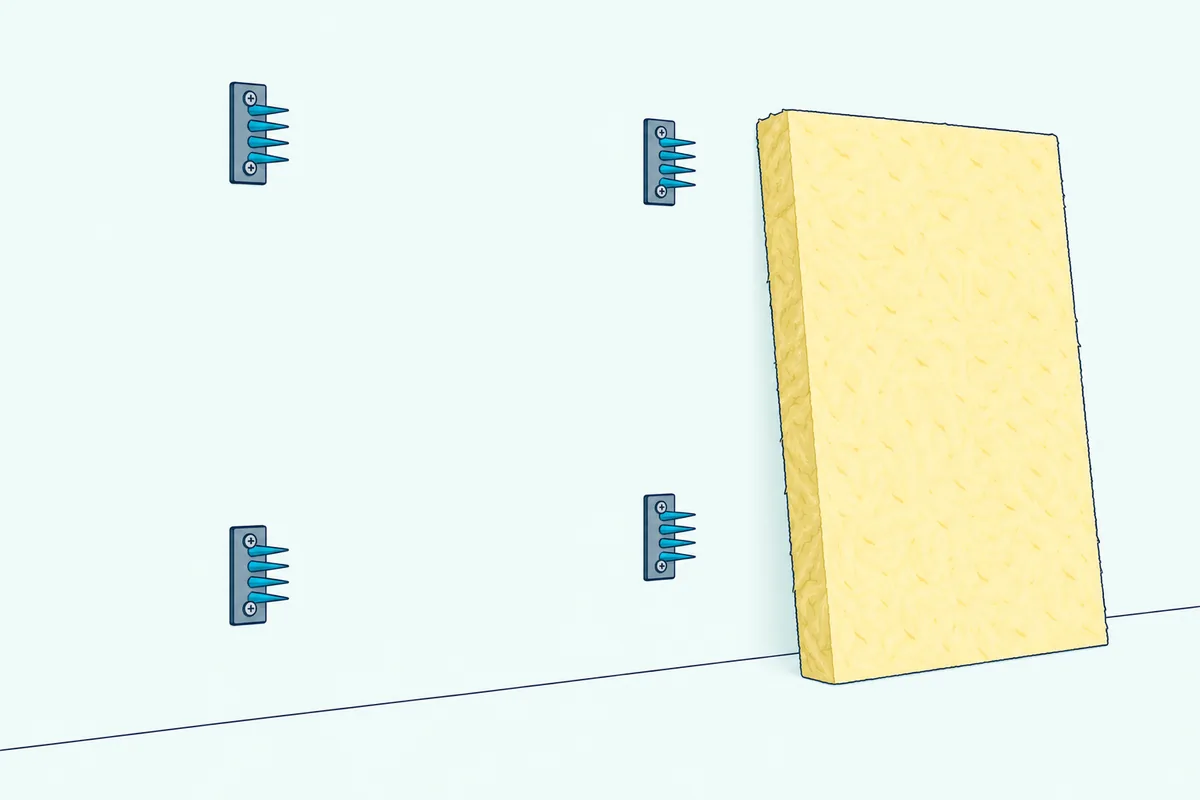 Four metal impaling clips with upturned spikes screwed to a light wall in a rectangle, beside a bare fiberglass board