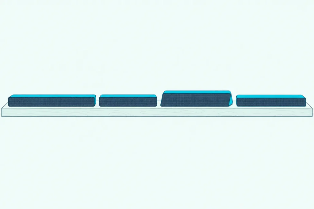 Four slim soundbars of different lengths lined up in a row on a low wooden shelf