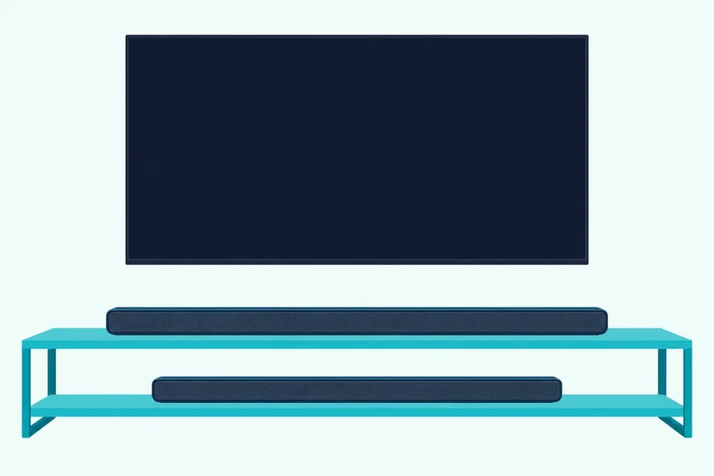 Longer and shorter dark soundbars on the two shelves of a low media unit under a wall-mounted TV with a blank screen