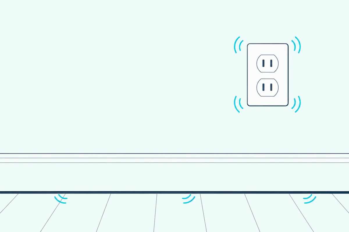Sound arcs passing through a gap under a baseboard and around an outlet in an old plaster wall