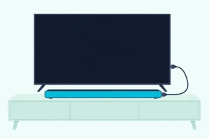 Slim soundbar in front of a flat TV on a low console, joined to the TV by one HDMI cable
