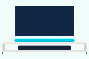Two long rounded soundbars, a slimmer one on a light console and one on its open shelf, under a blank wall-mounted TV