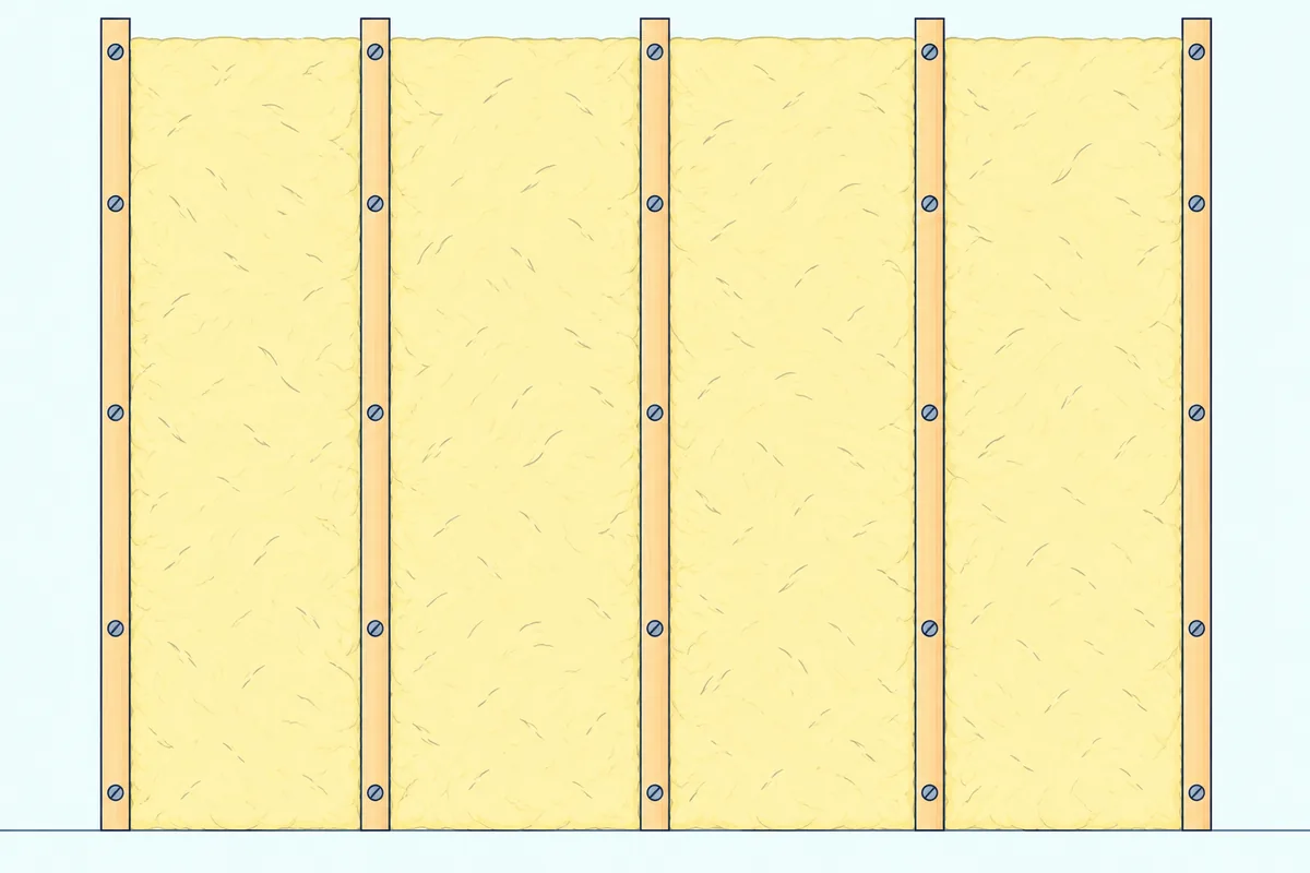 Vertical wood furring strips screwed to a bare wall with slabs of mineral wool insulation fitted between them